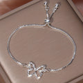 Pulsera de tenis mariposa brillante – Diseño hueco con diamantes de imitación